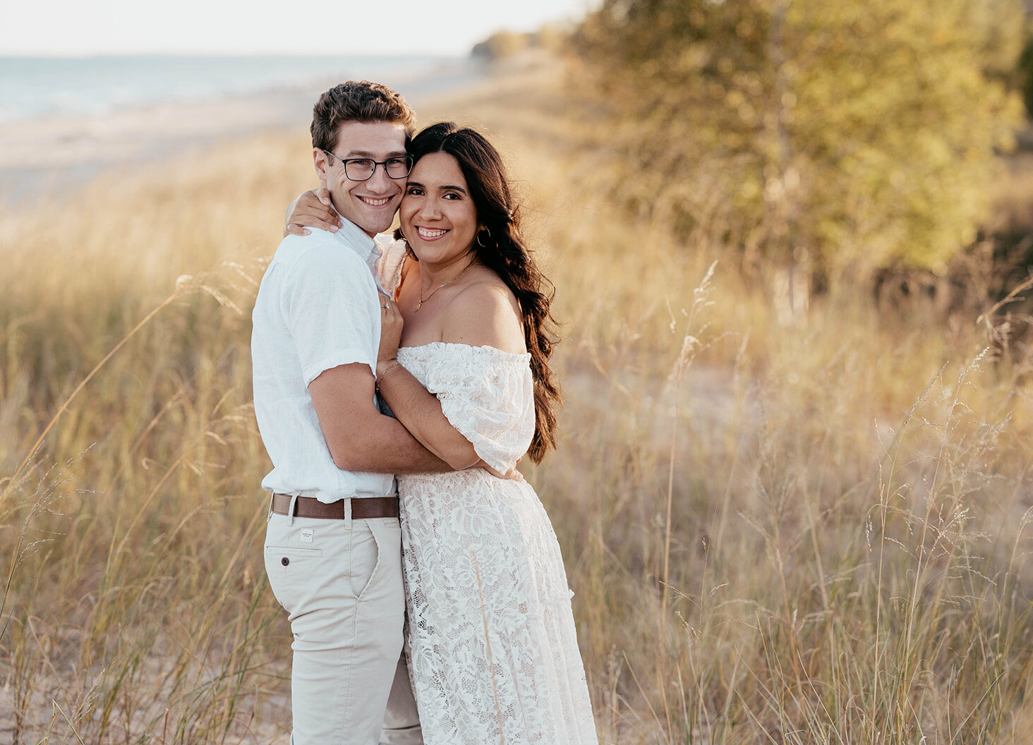 Engagement photos at Kohler-Andrae State Park in Sheboygan, WI. Golden hour beach session captured by a Wisconsin wedding photographer.