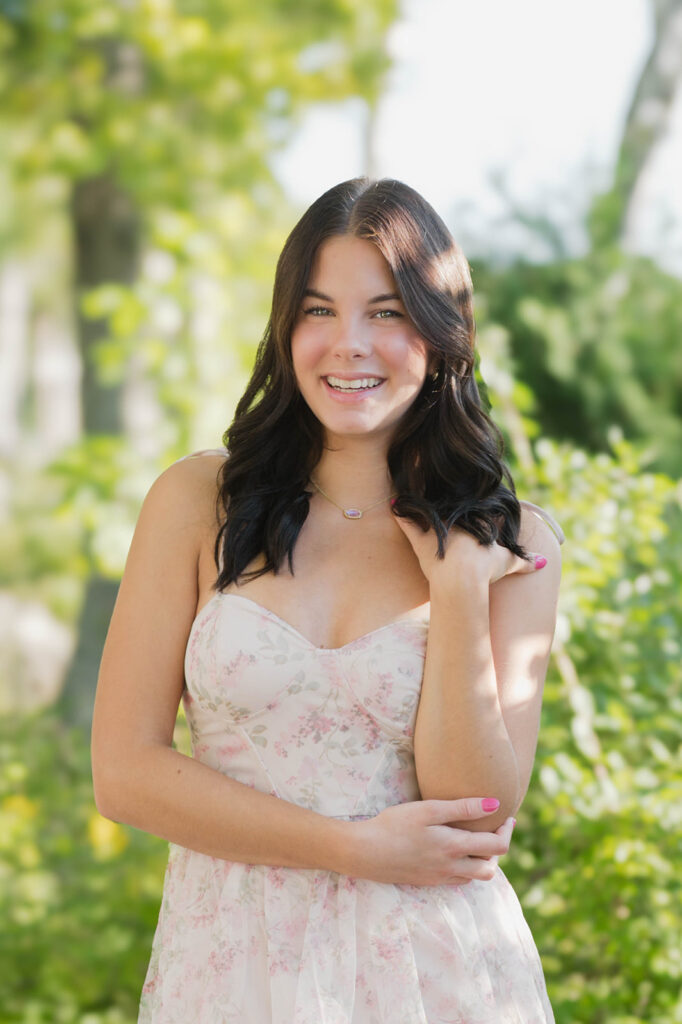 Senior girl walking through field during Green Bay senior session