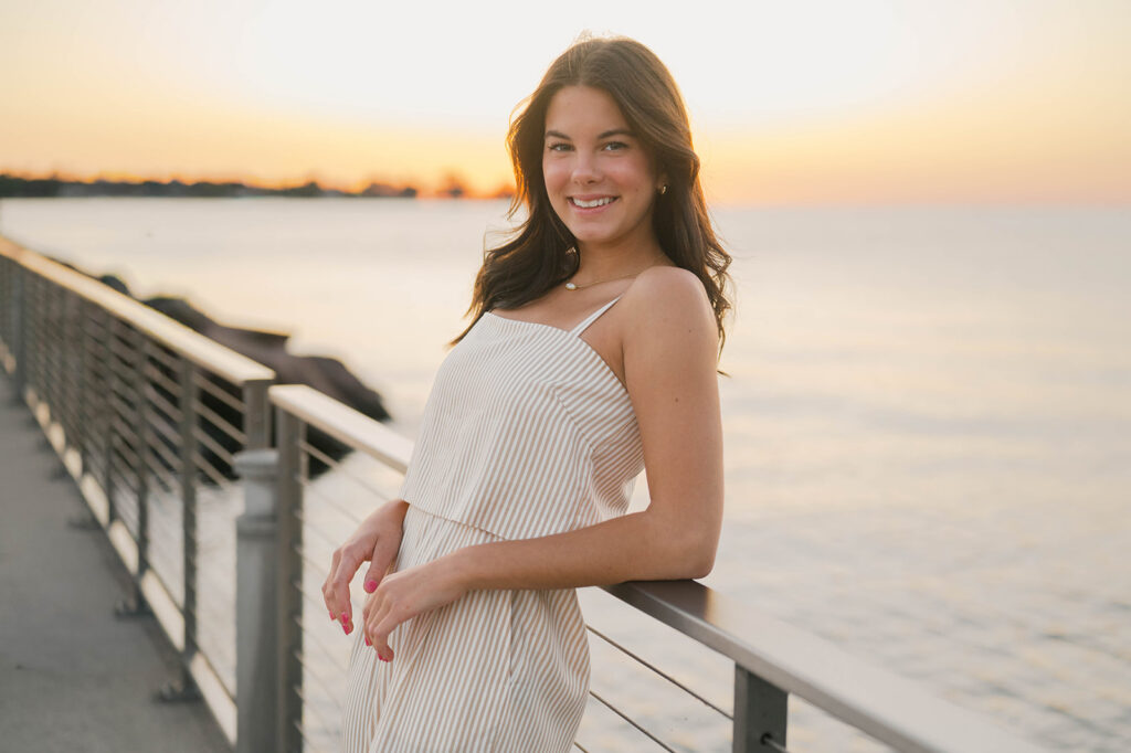 Green Bay senior girl smiling during golden hour senior session